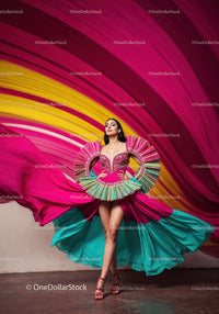 Fashion Model in Vibrant Pink and Yellow Flowing Gown