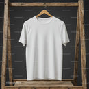 Minimalistic white t-shirt hanging on rustic wooden frame