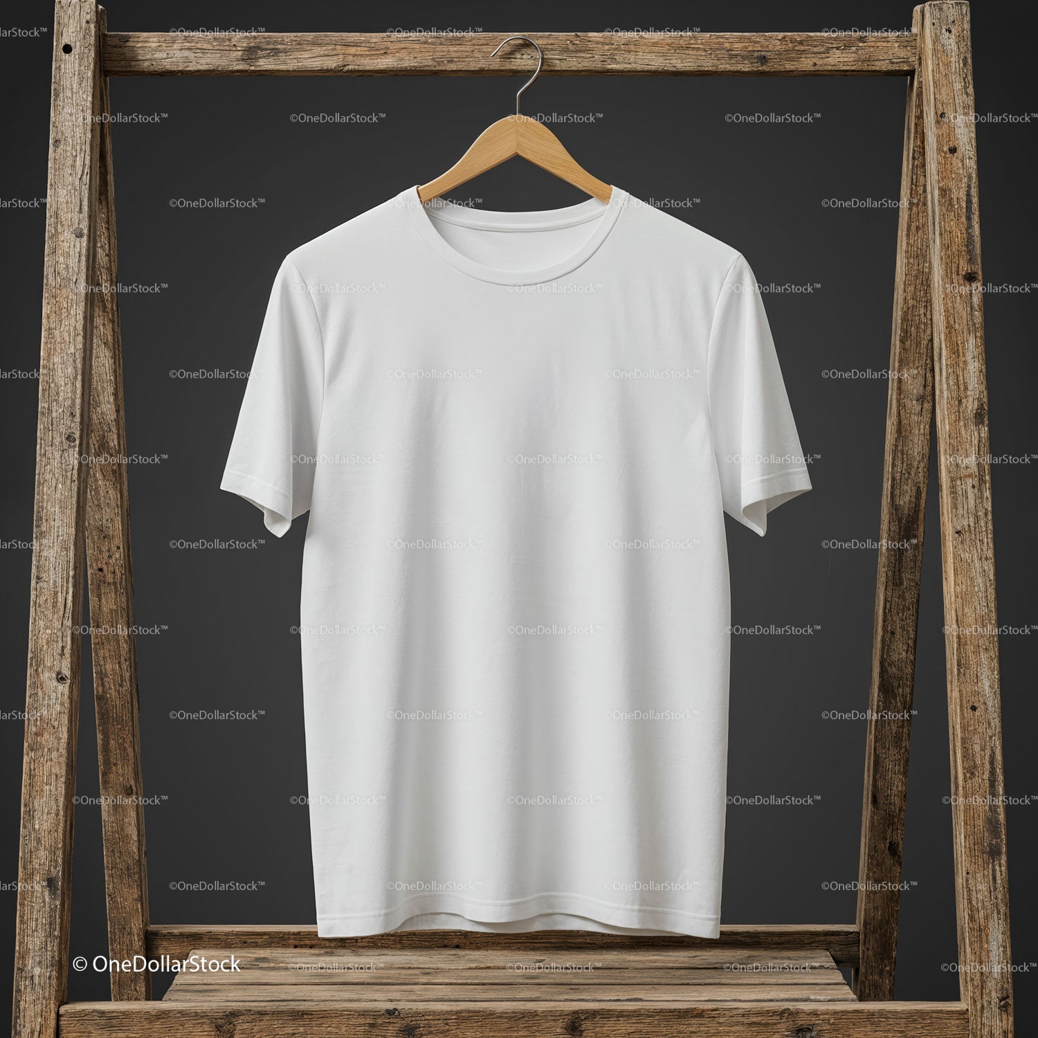 Minimalistic white t-shirt hanging on rustic wooden frame