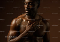 Male Model Applying Body Lotion for Skincare and Wellness