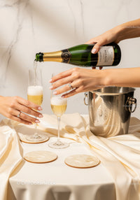 Elegant Champagne Pouring Scene with Two Flutes in Celebration Setting
