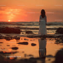 Silhouette of a Child at Sunset by the Ocean Shore
