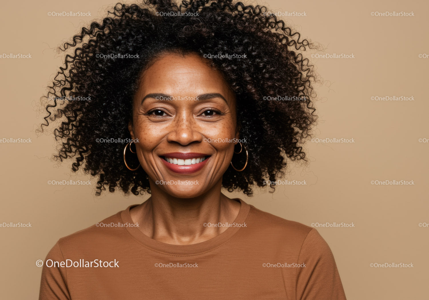 Confident Smiling Black Woman with Curly Hair in Studio Portrait