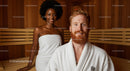 Smiling Ginger Man and African Woman Relaxing in Sauna Room