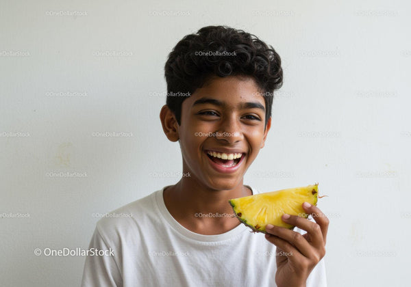 Smiling Boy Holding Fresh Pineapple in Bright Casual Scene