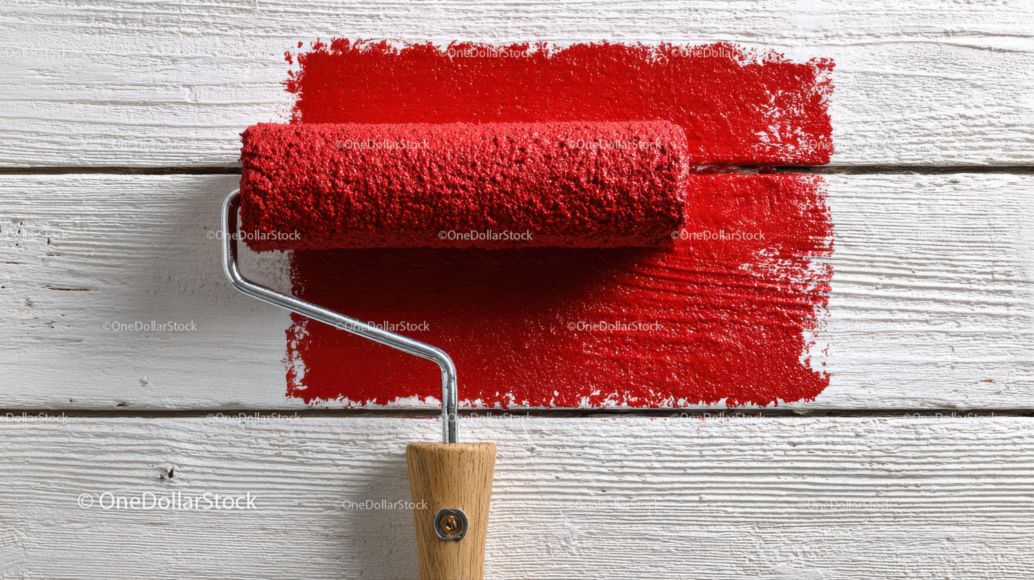 Red Paint Roller on White Wooden Surface for Interior Decor
