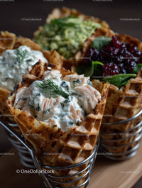 Delicious Chicken Waffles with Creamy Dill Sauce on Wooden Table