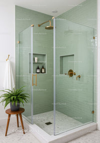 Modern bathroom with glass shower and green tiles