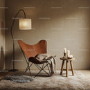 Cozy leather butterfly chair corner with warm lighting