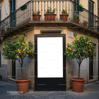 Urban corner with orange trees and blank billboard