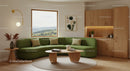 Cozy Living Room with Green Sofa and Natural Wood Accents