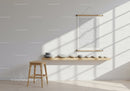 Minimalist room with wooden stool and decorative stones