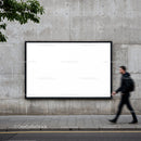 Blank urban billboard on concrete wall with pedestrian