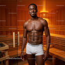 Male Fitness Model in Sauna with Toned Physique and Warm Wooden Interior
