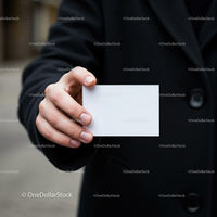 Person Holding Blank White Business Card Close Up