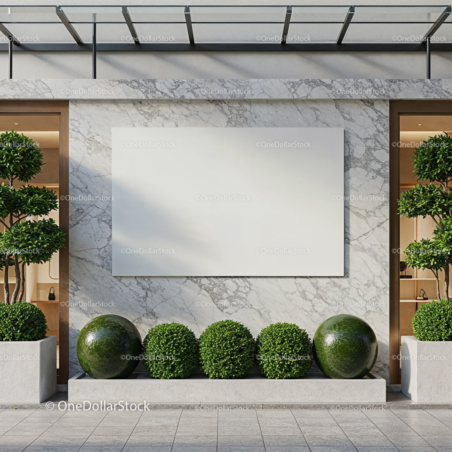Modern outdoor wall with blank white panel and greenery