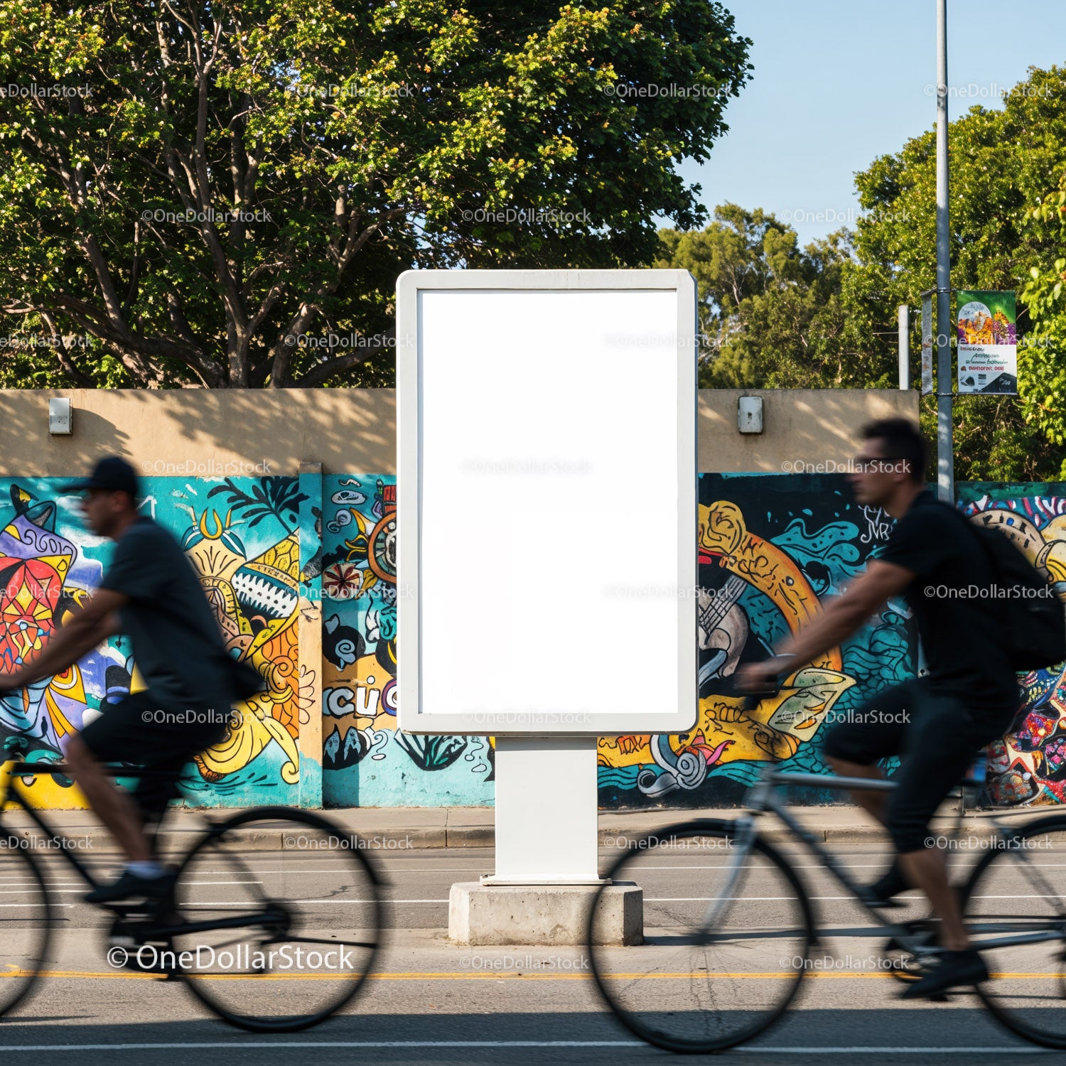 Blank Outdoor Billboard with Cyclists Passing By Urban Wall