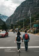 Mountain Road with Hikers and Scenic Landscape