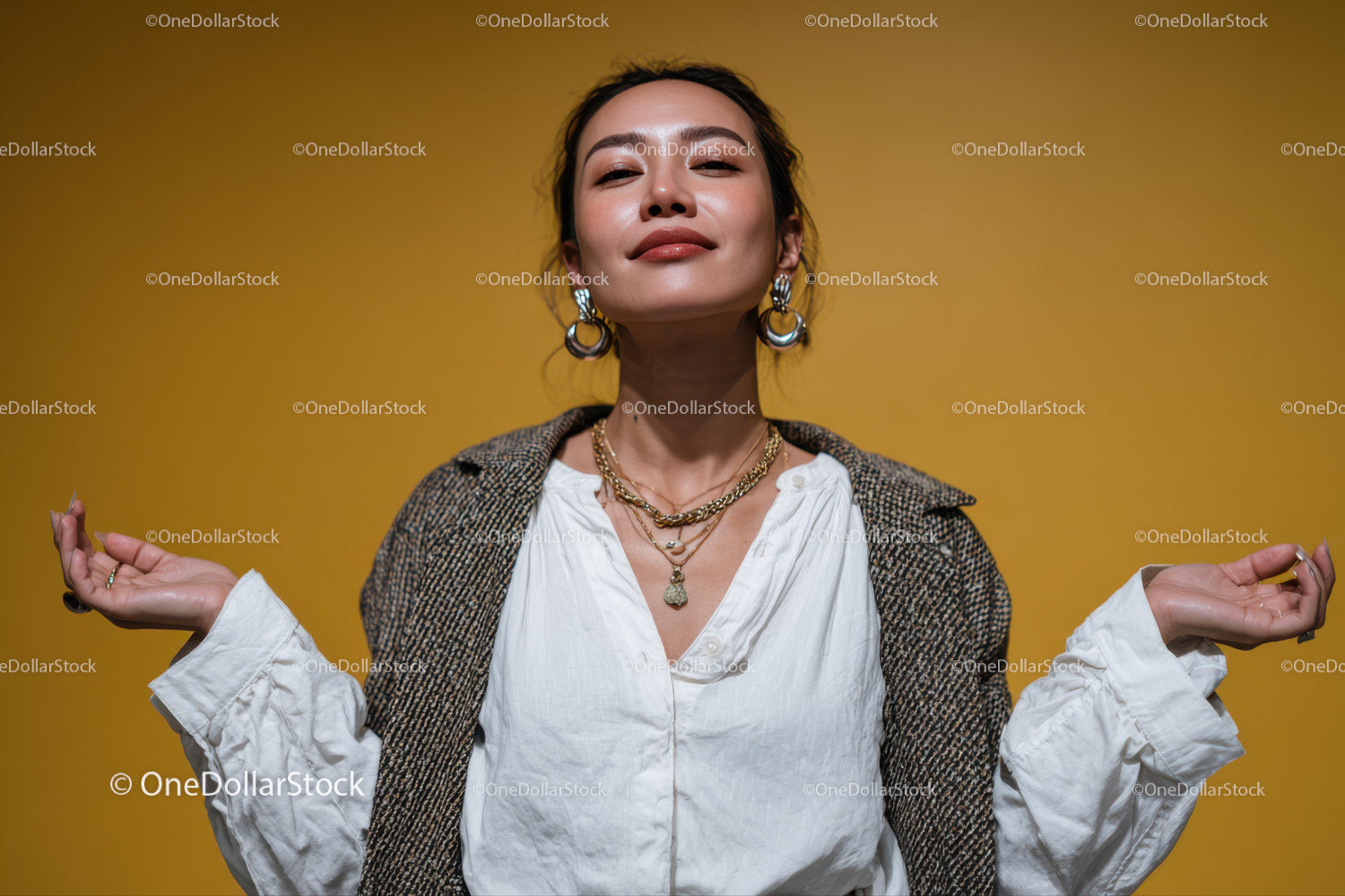 Confident Woman Wearing Jewelry with Yellow Background