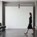 Woman in black dress walking through modern minimal interior