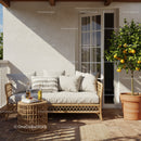 Cozy outdoor patio with rattan sofa and lemon tree
