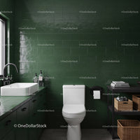 Modern Green Tiled Bathroom with White Toilet and Black Countertop