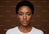 Close-up of a Freckled Young Woman with Short Curly Hair