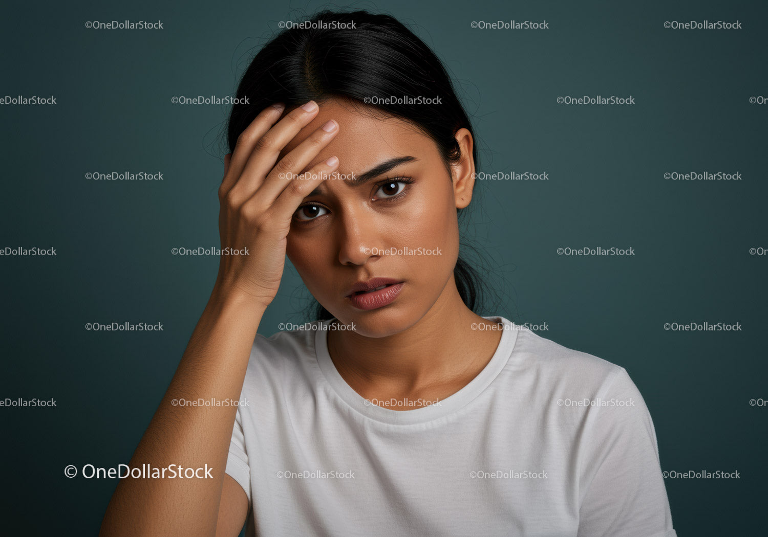Expressive Female Portrait with Serious Look and Hand on Forehead