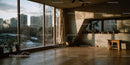 Modern Urban Living Room with Large Windows and City View