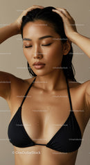 Elegant Woman with Water Droplets in Black Bikini Top for Spa or Beauty Ads