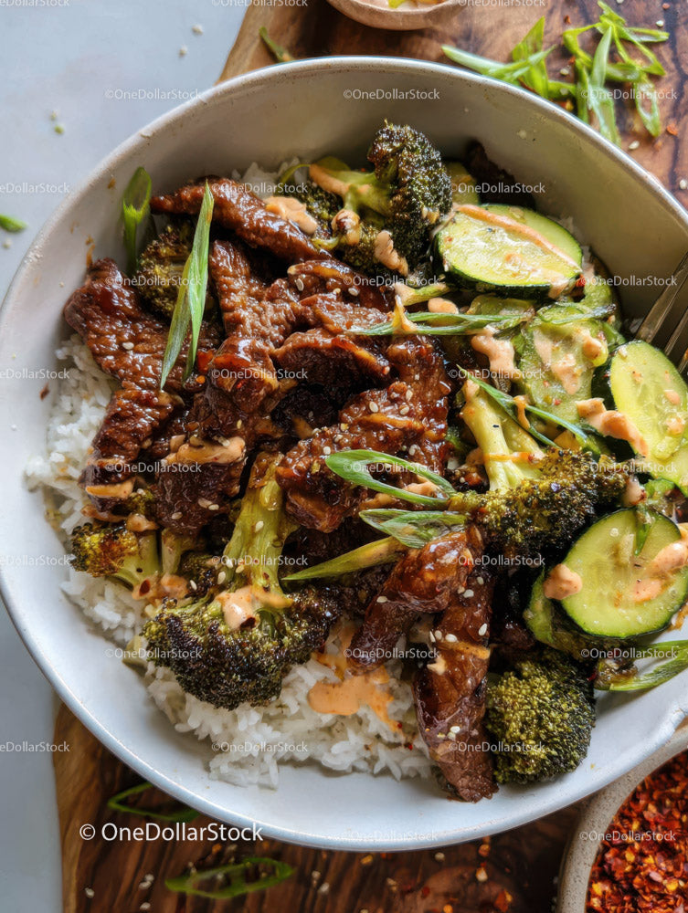 Colorful Vegetable and Beef Stir-Fry Over Rice with Broccoli and Zucchini