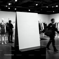 Blank Display Board in Modern Fashion Store Interior