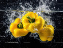 Yellow Bell Peppers Splashing in Water Vibrant and Fresh