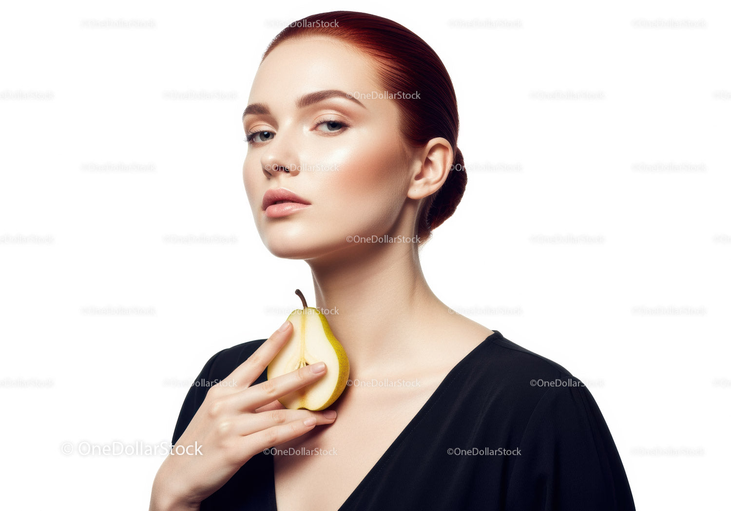 Elegant Woman Holding Pear in Studio Portrait with Soft Lighting