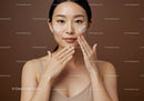 Young Woman Applying Facial Moisturizer for Skin Care Routine