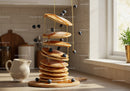 Stack of fluffy pancakes with blueberries and honey drizzle