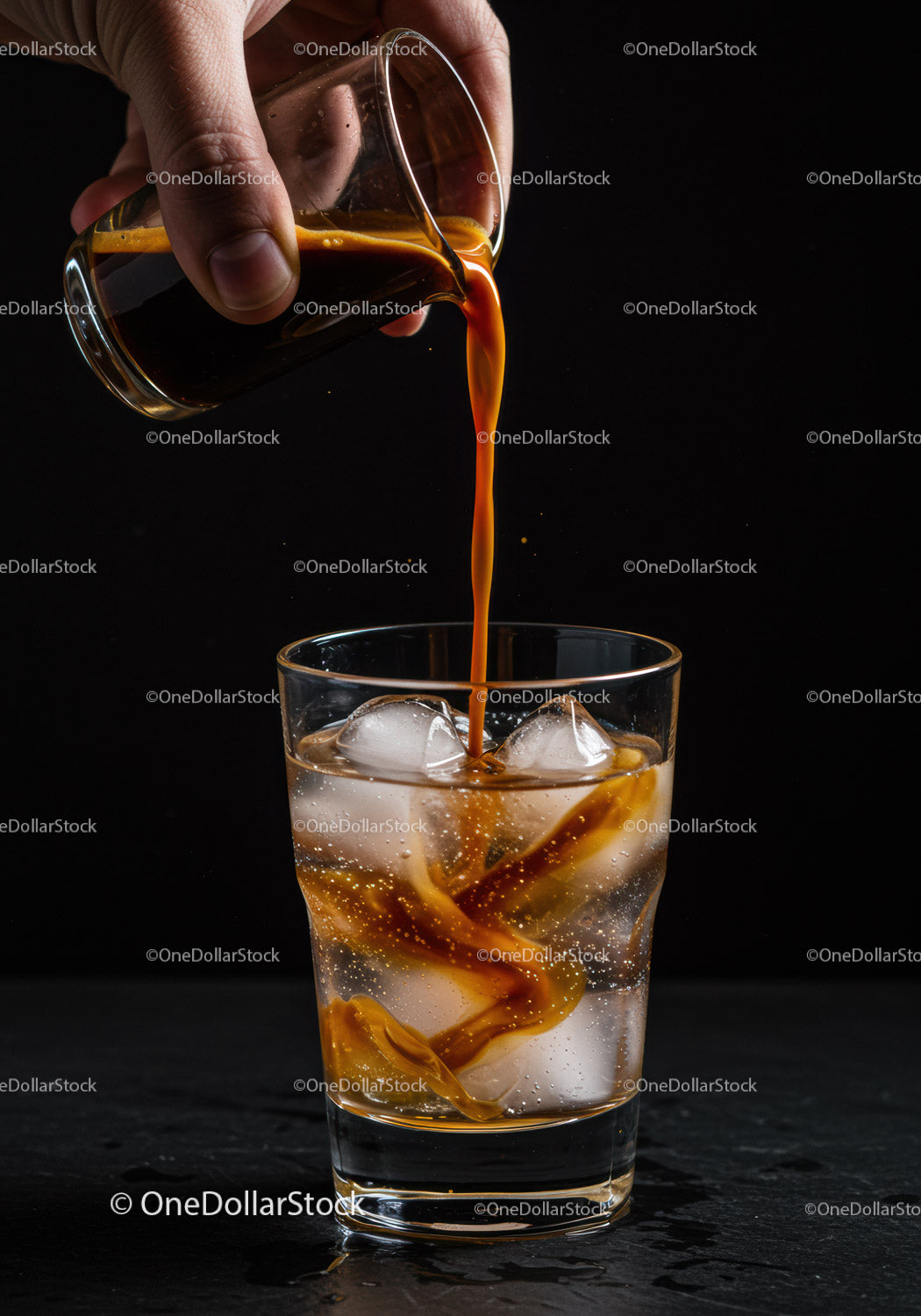Pouring Espresso Over Ice in Clear Glass