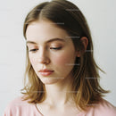 Elegant young woman with shoulder-length hair and natural makeup