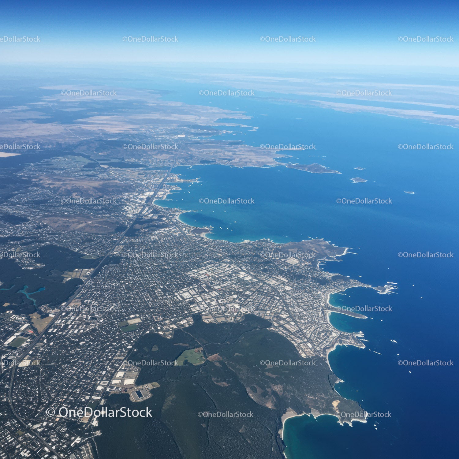 Aerial View of Coastal City with Water Bodies and Urban Landscape