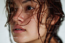 Close-Up of a Young Woman with Wet Hair and Glowing Skin