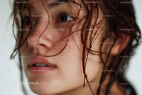 Close-Up of a Young Woman with Wet Hair and Glowing Skin