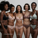 Diverse women laughing together in comfortable lingerie
