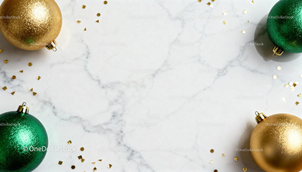 Festive Christmas baubles on white marble surface