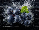Juicy Blueberries Splashing into Water with Leaf Underwater