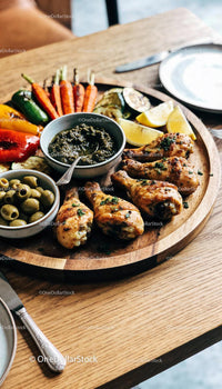 Grilled chicken drumsticks with roasted vegetables platter