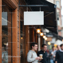 Blank hanging signboard outside wooden cafe facade