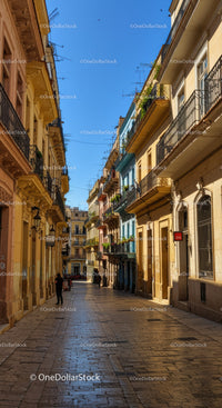 Colorful Mediterranean Buildings Along Narrow Sunny Alley