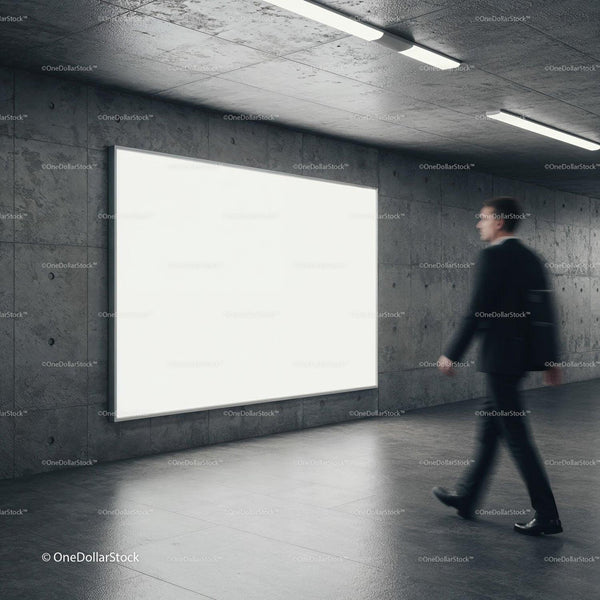 Businessman walking past large illuminated blank billboard JPG Mockup Image