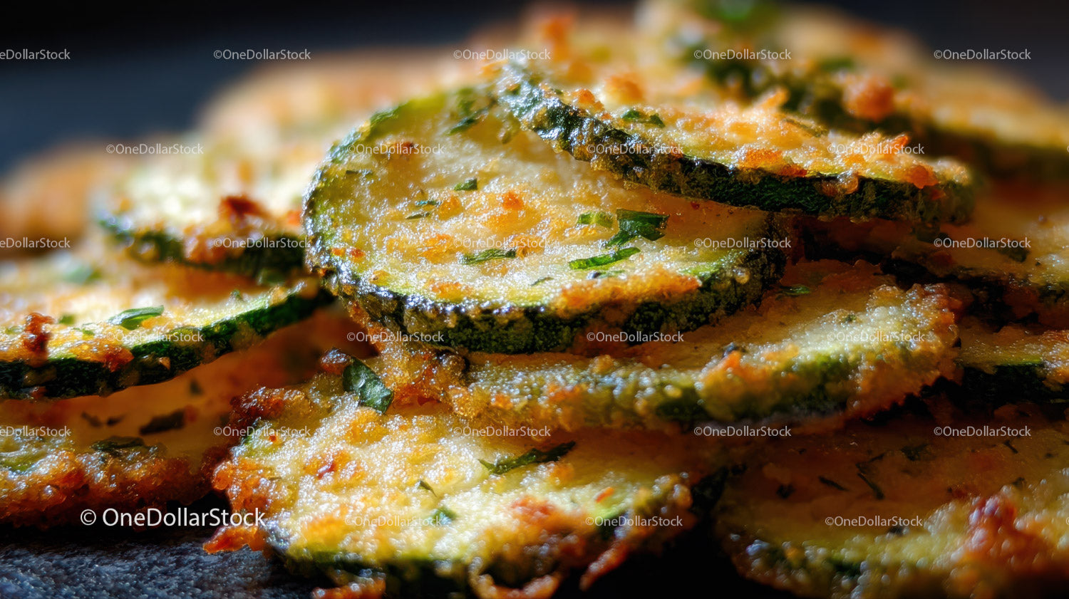 Close-Up of Crispy Fried Zucchini Slices with Seasoned Coating