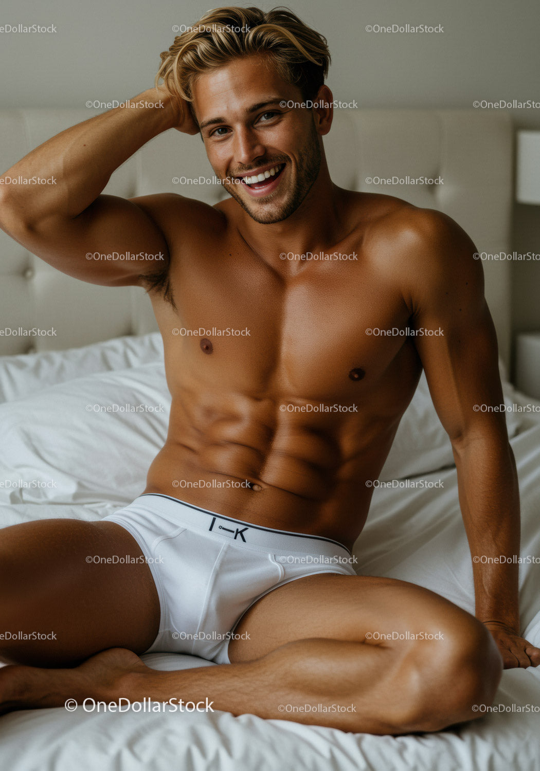 Smiling fit man relaxing on bed in white underwear